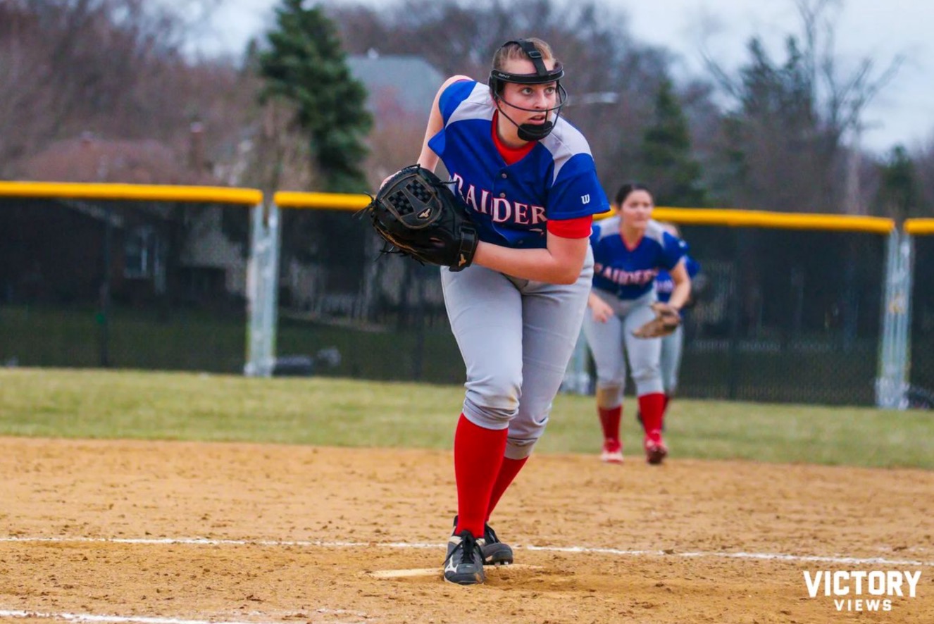 Sophomore+Daniella+Little+waits+for+signs+from+her+catcher+in+a+game+against+Naperville+North.+%28Photo+by+Charlie+Brown+for+Victory+Views%29