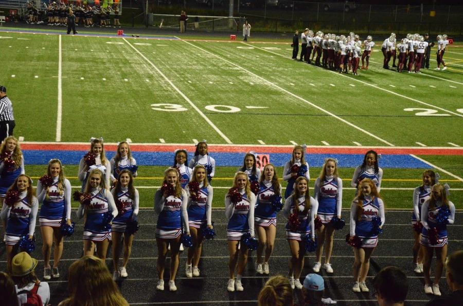 The GBS varsity cheerleaders pump up the home fans before the game.