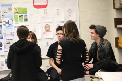 Students discuss various topics at a GSA meeting.