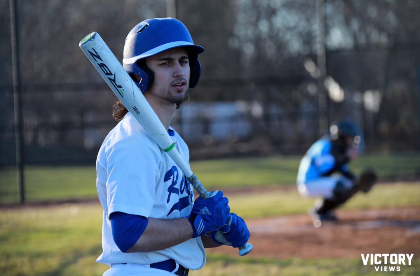Junior+Mike+Paprota+looks+back+at+his+teammates+before+stepping+to+the+plate+in+a+game+against+Willowbrook.+%28Photo+by+Won-Sik+Kim+for+Victory+Views%29