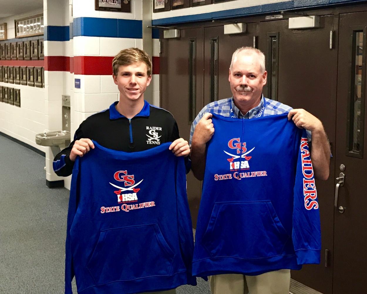 Sophomore state qualifier Alex Bergendorf and Coach Conrad proudly display their new sweatshirts. (Photo by Tim Carlson)