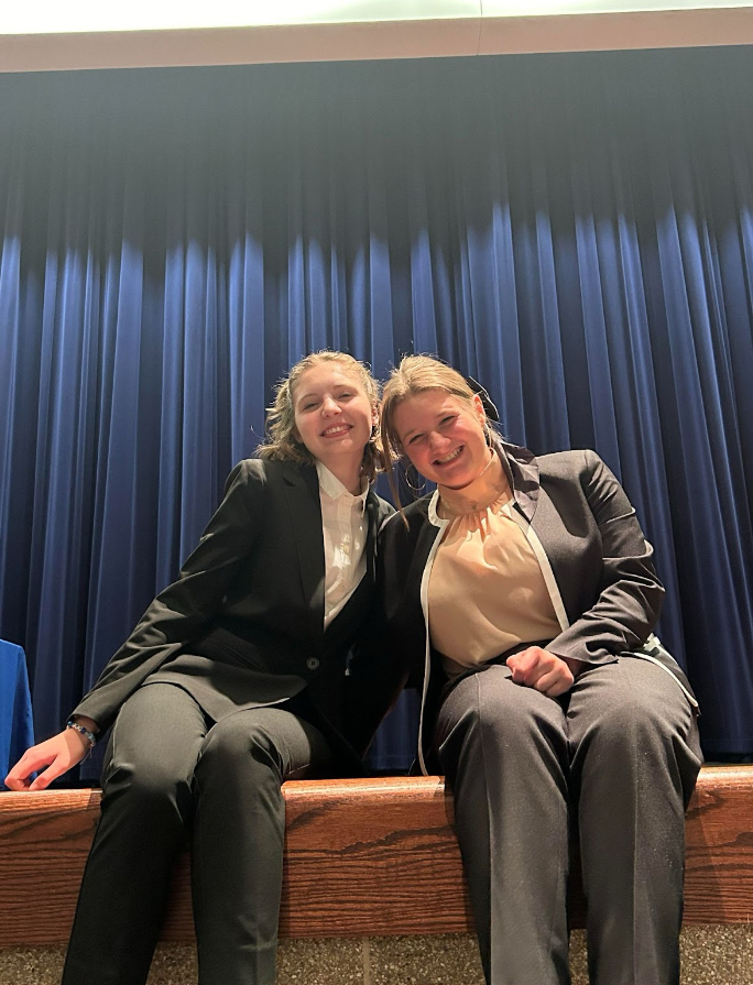 Co-captains Emma Pekkarinen (left) and Abby Anderson (right) at the speech tournament. 
