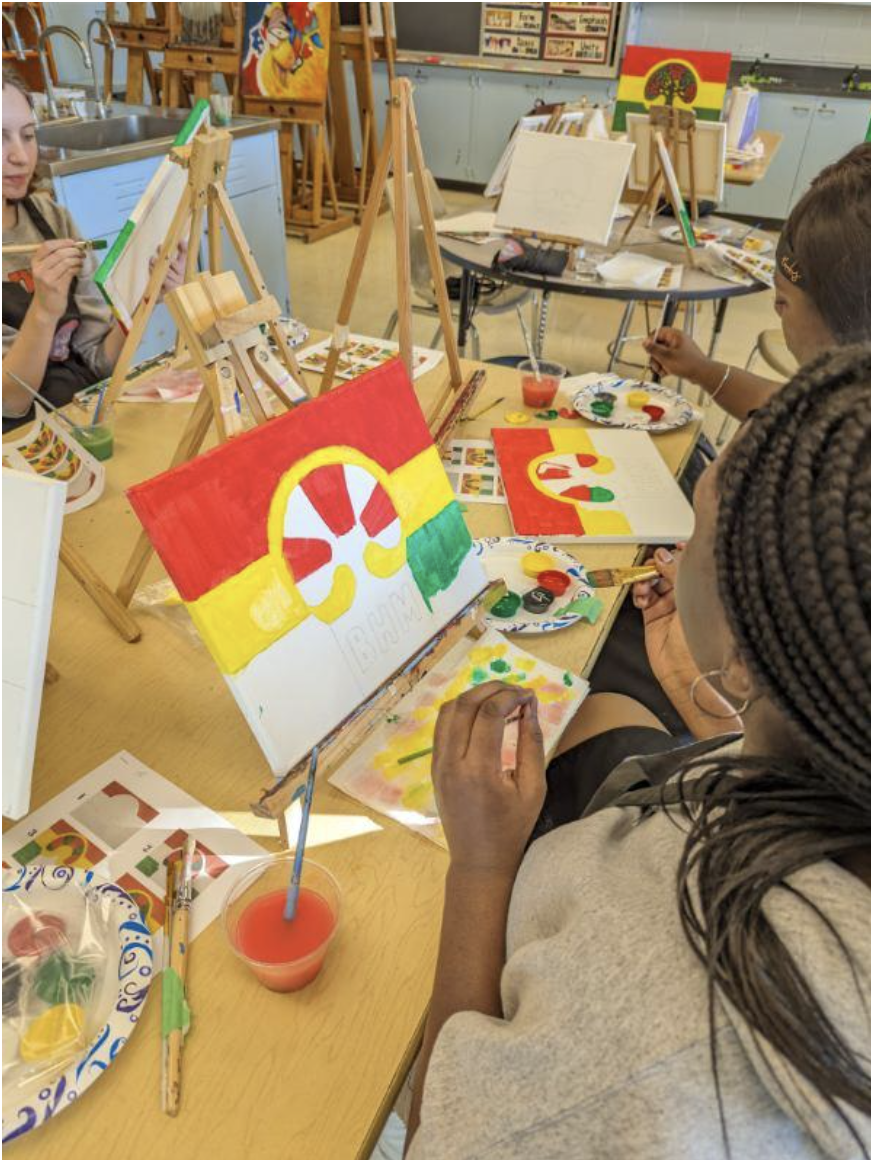 Caption: Student Zaria Taylor painting her canvas. Source: Ms. Jamea Harper.